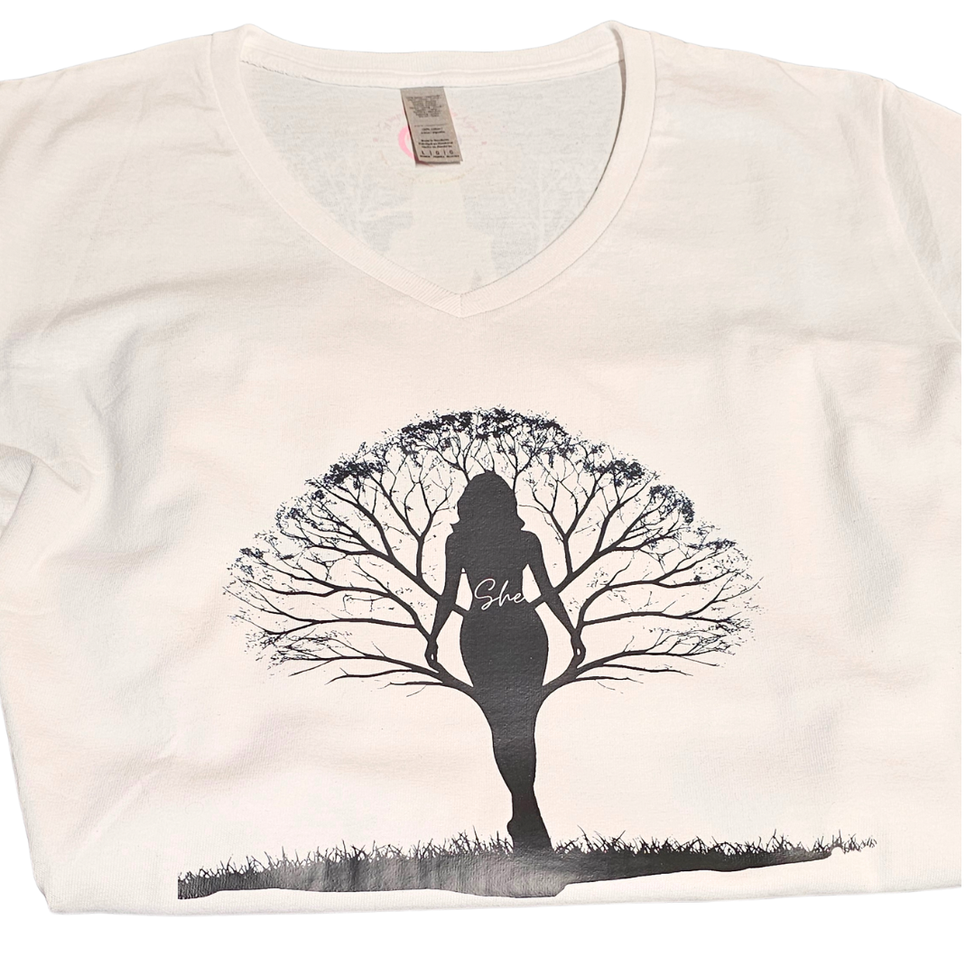 White V-neck T-shirt by Try My Closet with a black silhouette of a woman with tree-branch hair and “She.” Enjoy exclusive designs or request Custom Orders for a unique, personalized look based on existing designs.