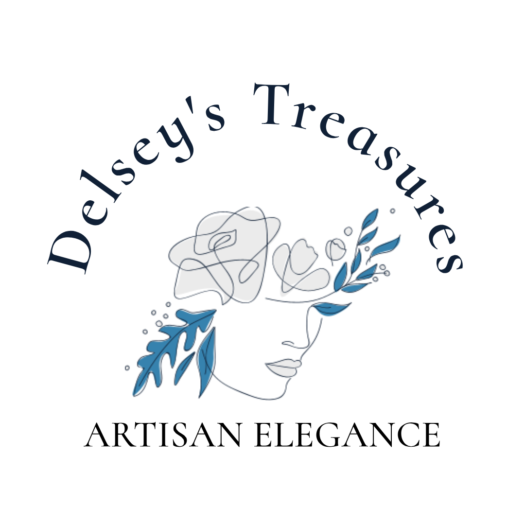 Logo for Delseys Treasures featuring a minimalist line drawing of a face with blue floral elements, and the words ARTISAN ELEGANCE beneath the illustration.