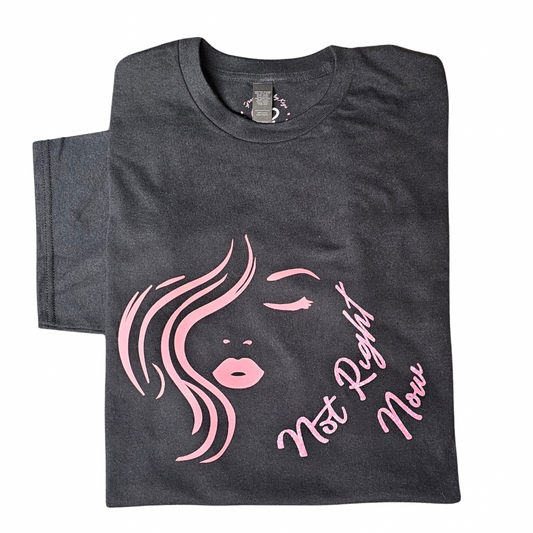 The Not Right Now Pink on Black Graphic Tee (Size L, Try My Closet) features a pink stylized woman’s face and diagonal text. Includes free pouch. Custom orders available for personalization.