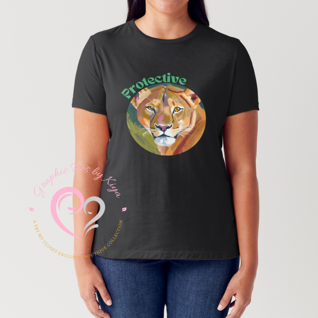 A woman wears the Protective Graphic Tee by Try My Closet, featuring a vibrant lioness face in a circle with Protective in green above. The unique black t-shirt allows custom orders. A pink Graphic Tees by Kejan watermark overlays the design.