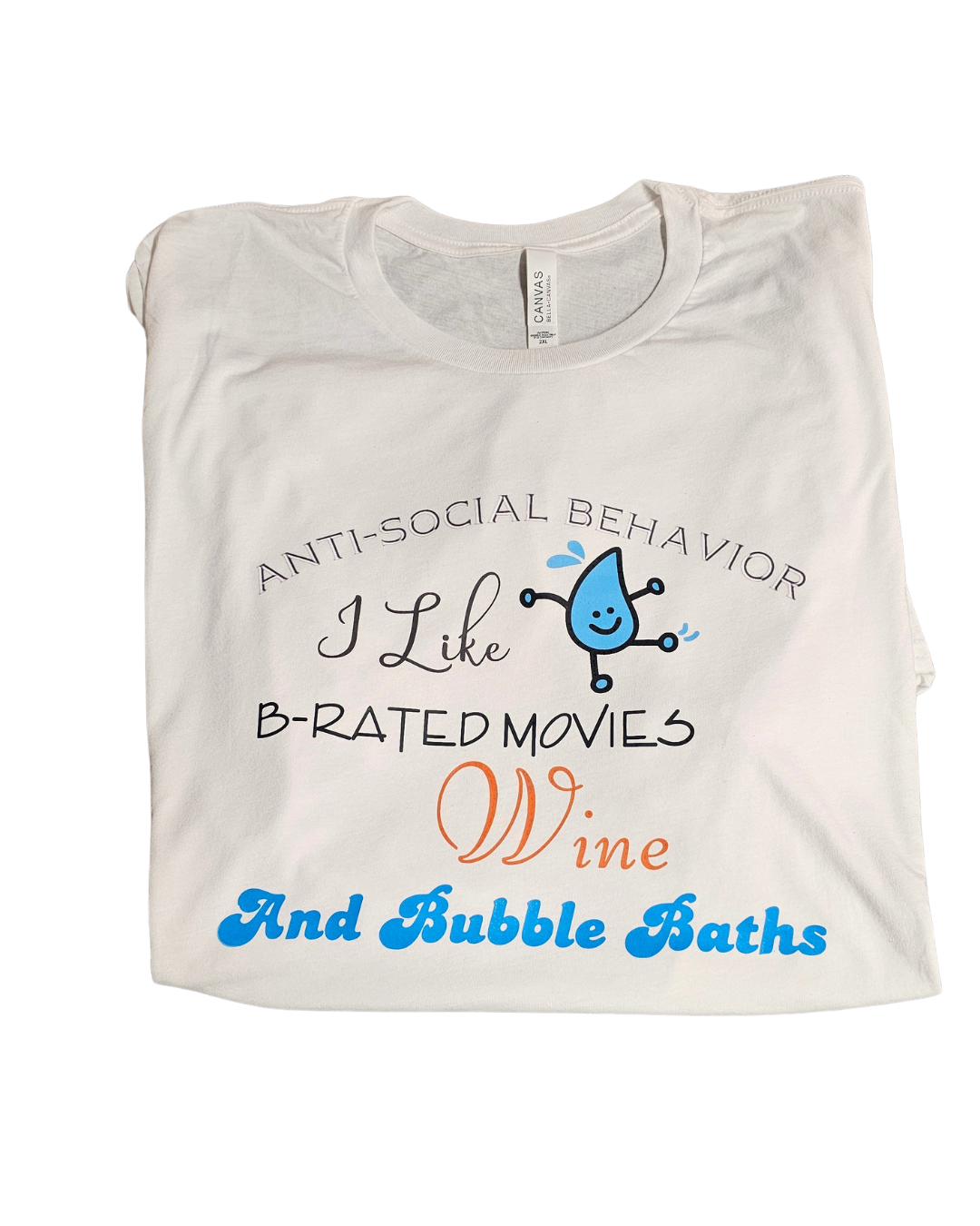 The Anti-social Behavior Graphic Tee by Try My Closet is crafted from soft cotton and showcases quirky fonts plus cute wine glass and water droplet illustrations—perfect for cozy movie nights. Custom orders available to match your unique style!.