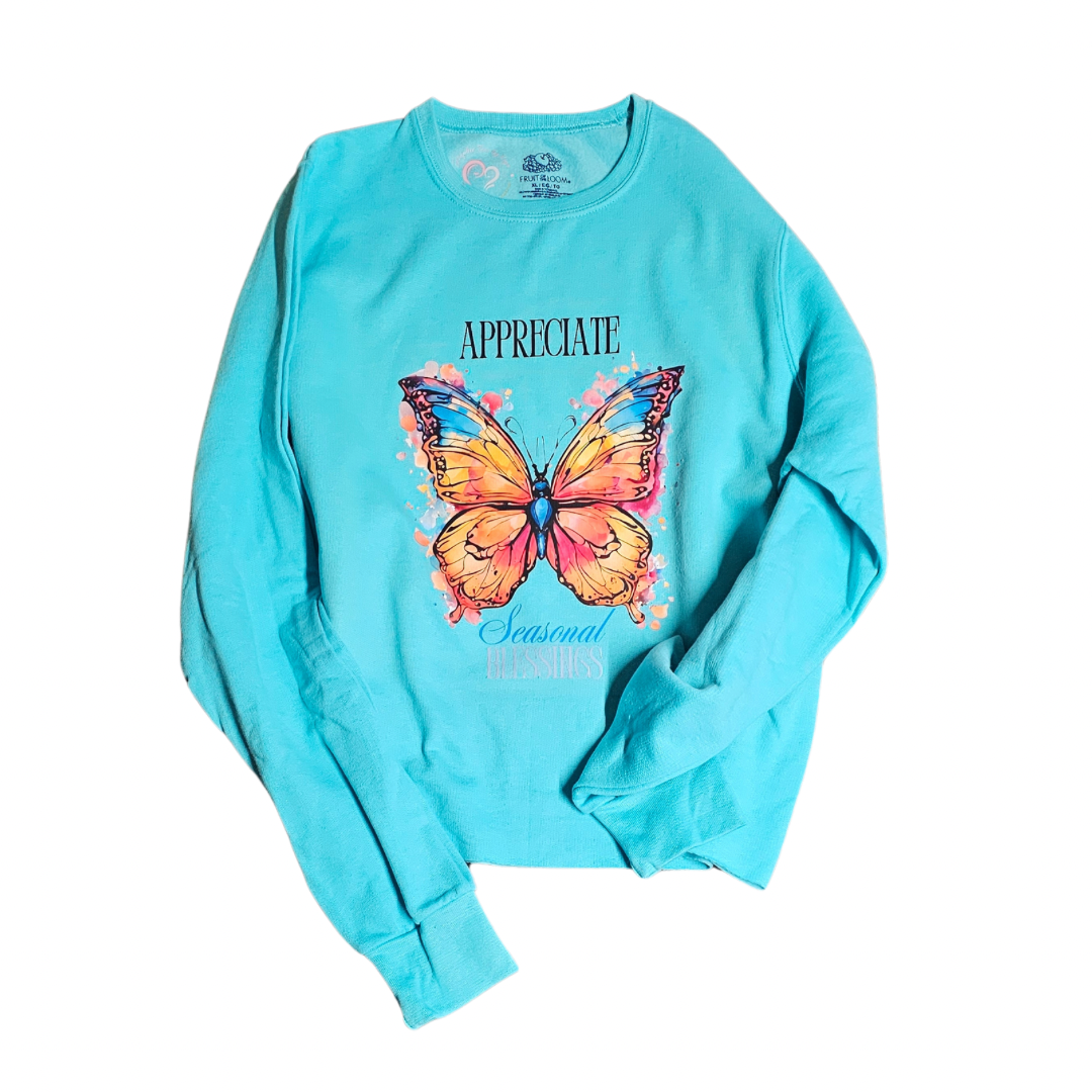Try My Closet’s “Appreciate Seasonal Blessings” Cropped Turquoise Sweatshirt (XL) features a vibrant butterfly graphic with “APPRECIATE” above and “Seasonal Freshness” below—ideal for celebrating the season. Custom orders available.