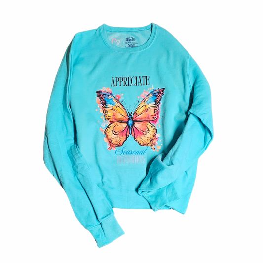 Try My Closet’s “Appreciate Seasonal Blessings” Cropped Turquoise Sweatshirt (XL) features a vibrant butterfly graphic with “APPRECIATE” above and “Seasonal Freshness” below—ideal for celebrating the season. Custom orders available.
