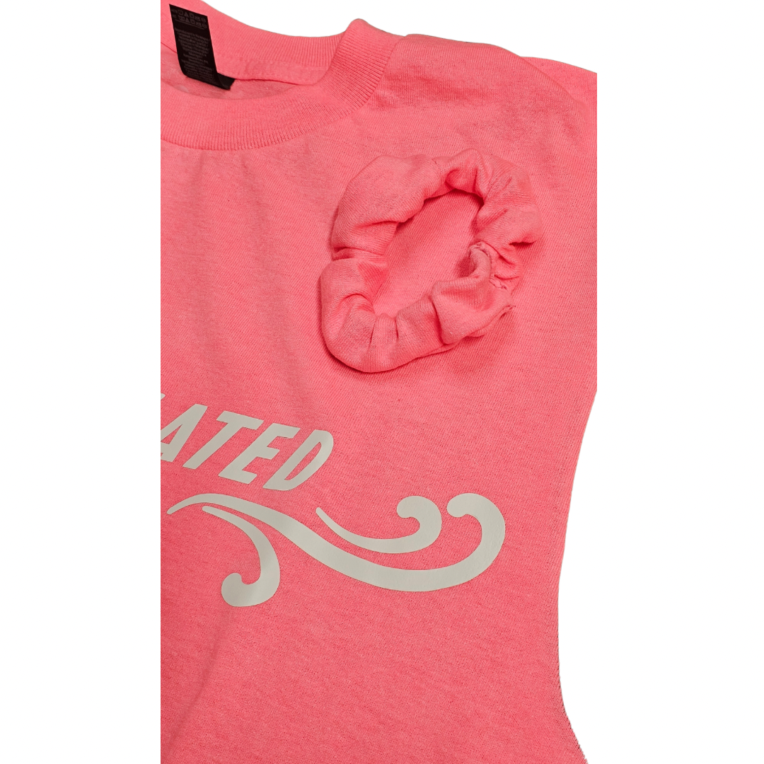 The Try My Closet Retro Style Overstimulated Graphic Tee in hot pink features white decorative text, a swirl design, and comes with a free matching pink scrunchie placed near the collar.