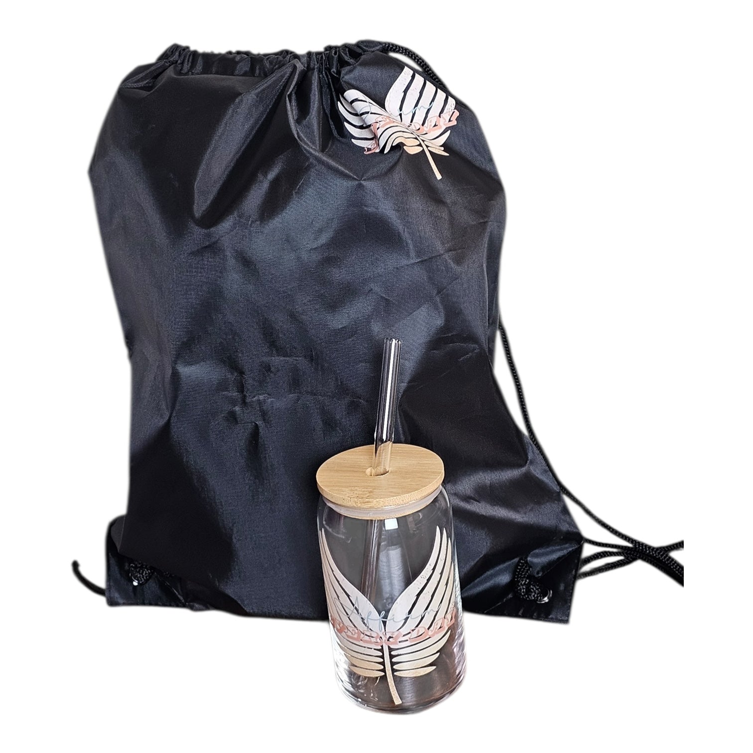 The Try My Closet Affirm Everyday Glass Tumbler and Lightweight Drawstring Backpack Value Set features a black drawstring bag with a white and pink leaf motif, plus an eco-friendly glass tumbler with bamboo lid and matching straw.
