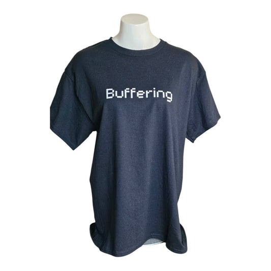 The Buffering Black Graphic Tee by Try My Closet features Buffering in white pixelated text across the chest. Displayed on a mannequin with a plain white background. Custom orders available.