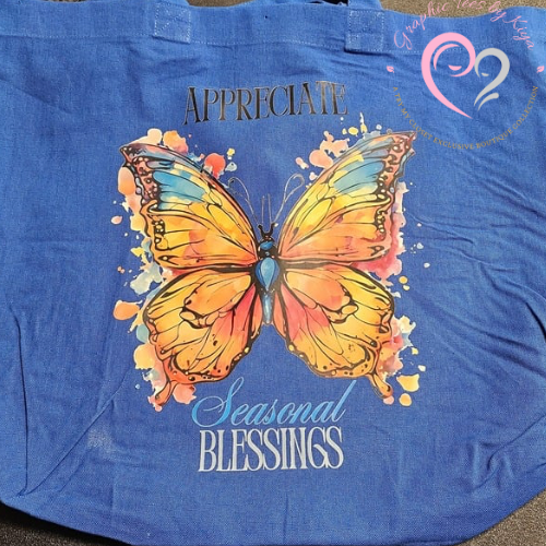 The Try My Closet Appreciate Seasonal Blessings Reusable Tote features a blue watercolor butterfly design with “APPRECIATE” above, “Seasonal Blessings” below, and a heart-shaped logo accent in the top right corner.