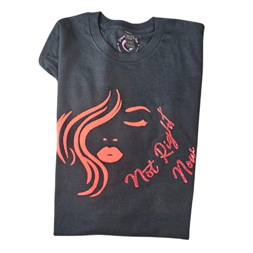 The Not Right Now Red on Black Graphic Tee by Try My Closet in size L features a bold red print of a womans face with wavy hair and the phrase Not Right Now in red script. Custom orders are available.