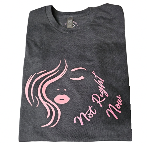 The Not Right Now Pink on Black Graphic Tee by Try My Closet features a pink minimalist womans face and cursive text, size Large, and comes with a free pouch—perfect for custom orders or as a stylish statement piece.