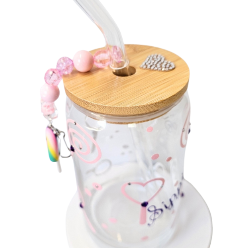 The Try My Closet Sippie Sippie Lollipop Candy Color Changing Glass Tumbler features a bamboo lid, glass straw, pink swirls, beads, a rhinestone heart, and a pink-purple beaded charm with rainbow pendant—perfect for cold drinks or parties.